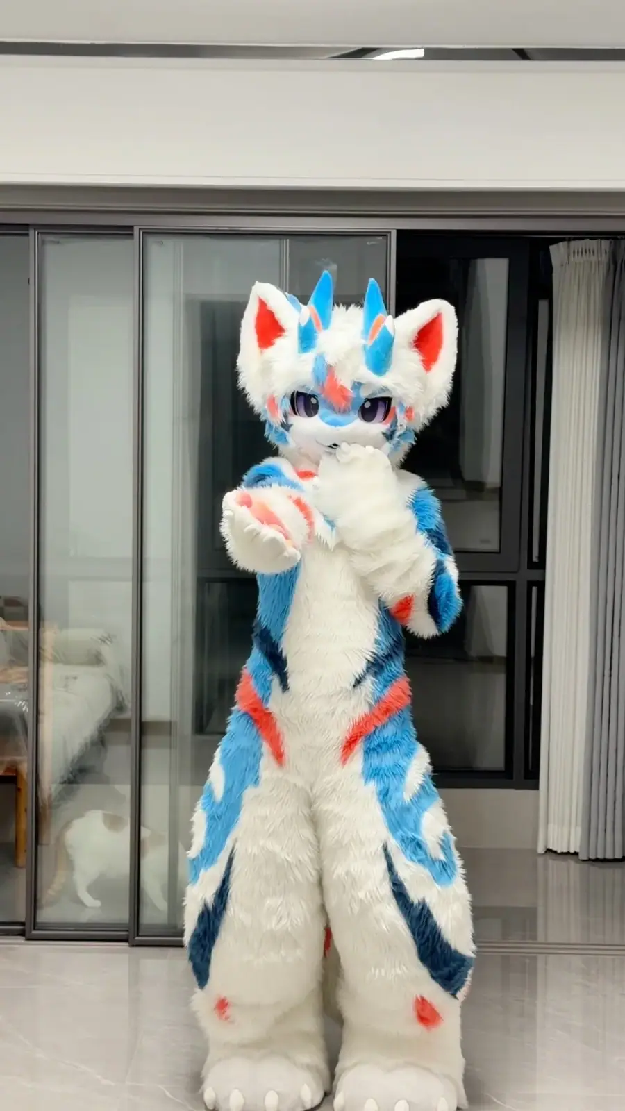 Kemono-style white and sky-blue horned dragon fullsuit with blue swirl markings, a digitigrade bodysuit and clawed feet paws, full-body front view