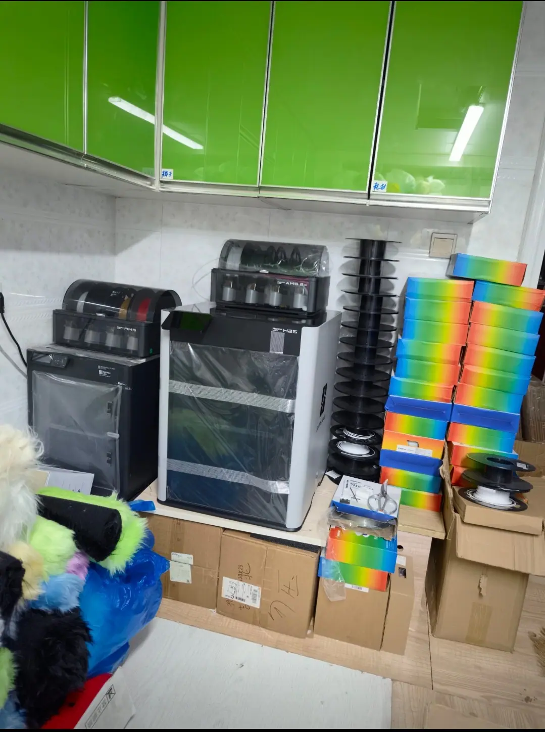 Our fursuit studio, with the 3D printers that make our head bases